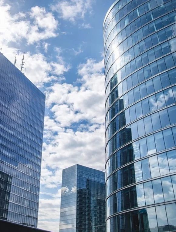 modern-glass-office-towers-sky-reflection